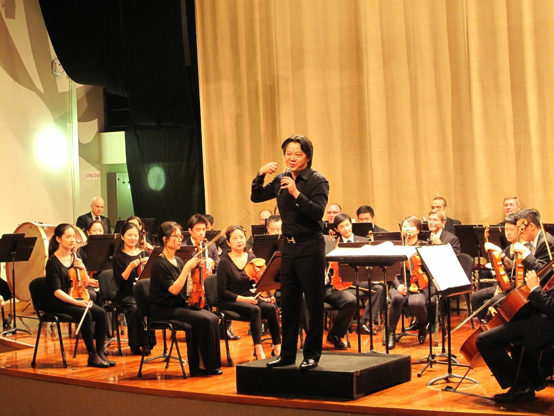 Mr. Francis Kan explains to the audience the meaning of each composition