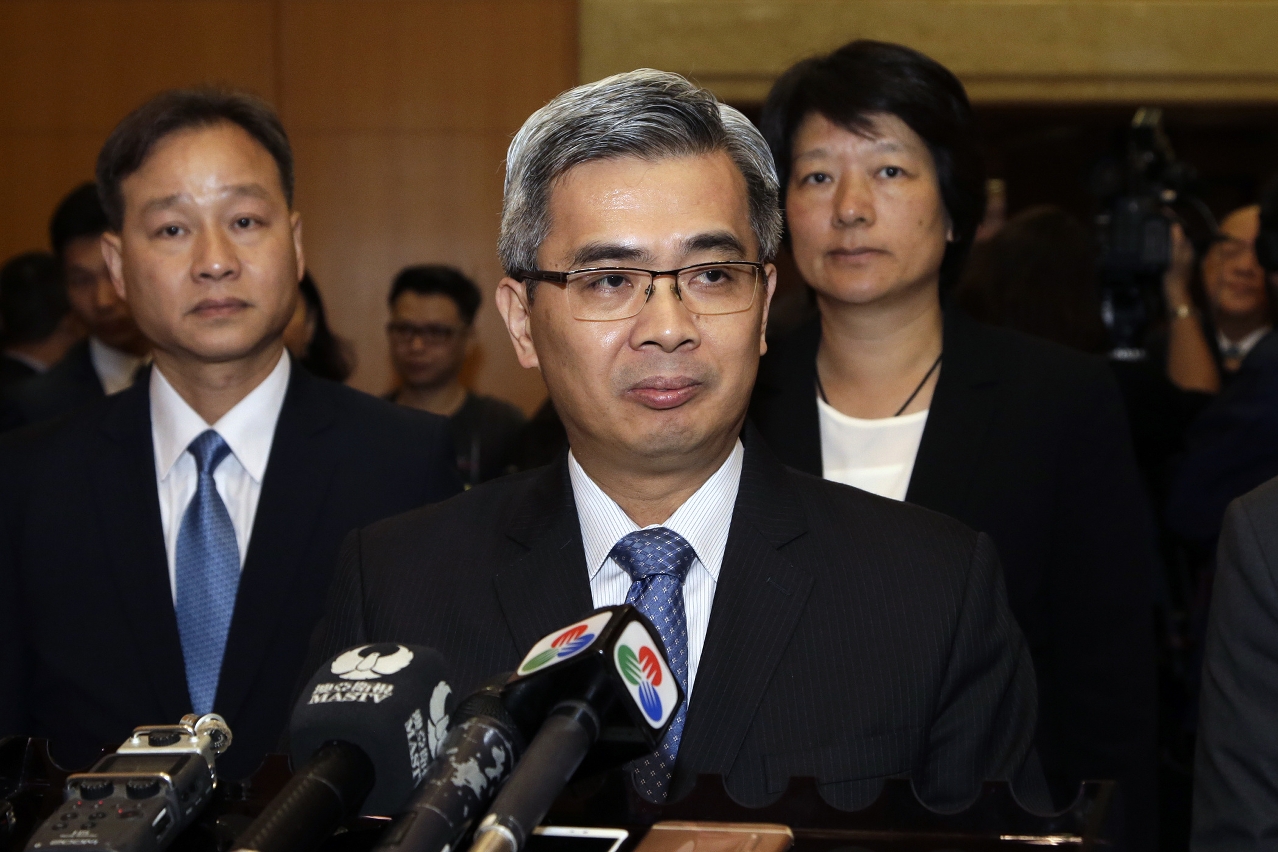 The Secretary for Security, Mr Wong Sio Chak, speaks to reporters.