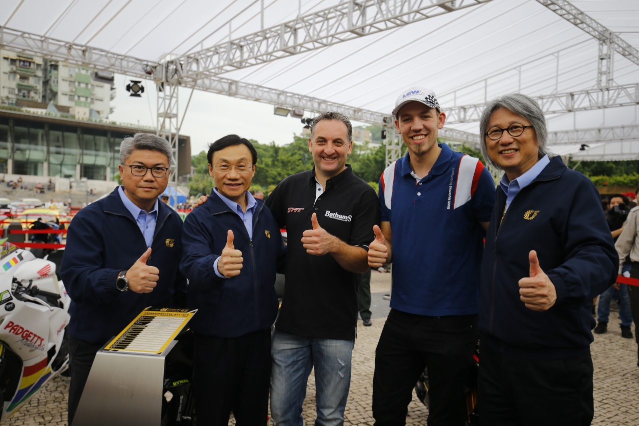Peter Hickman (right second) and Michael Rutter (middle) interact with guests