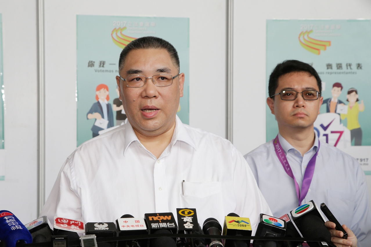 The Chief Executive, Mr Chui Sai On, speaks to reporters after casting his vote.