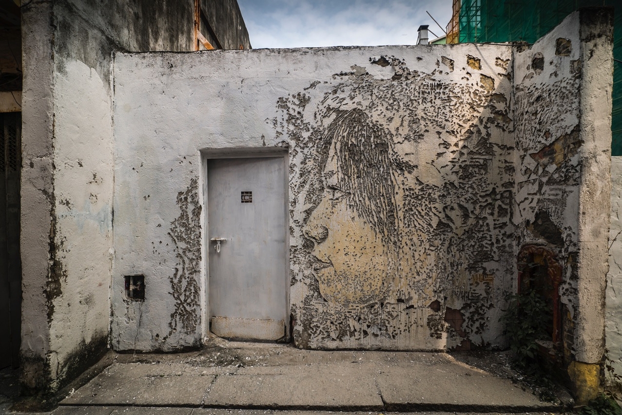 Works by Portuguese artist Alexandre Farto aka Vhils in Rua dos Clérigos in Old Taipa Village © Jose Pando Lucas