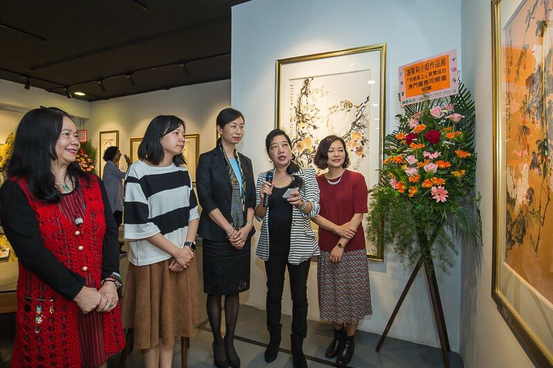 Guests appreciating the artwork of the exhibition.