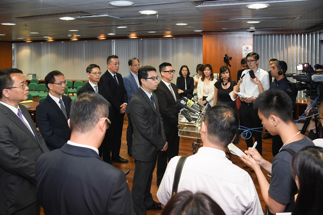 The Electoral Affairs Commission for the Legislative Assembly Election briefs reporters after the meeting.