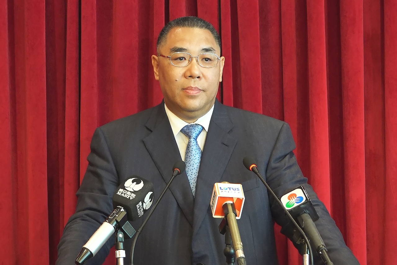 The Chief Executive, Mr Chui Sai On, speaks to reporters before his departure for Beijing.