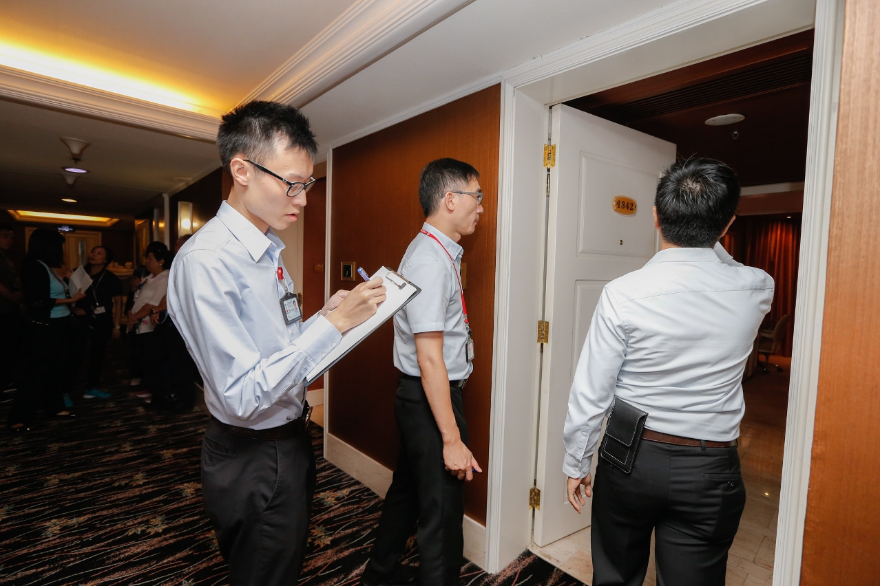Inspectors inspecting hotel rooms