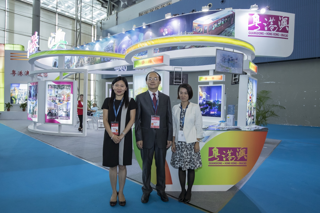 Tourism Administration of Guangdong Province Deputy Director Mei Qijie (center), MGTO Deputy Director Cecilia Tse (left) and HKTB representative (right) at the joint booth