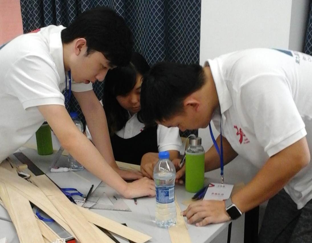 The UM team build the model bridge at the competition