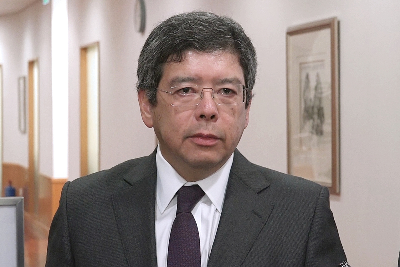 The Secretary for Transport and Public Works, Mr Raimundo do Rosário, speaks to reporters.