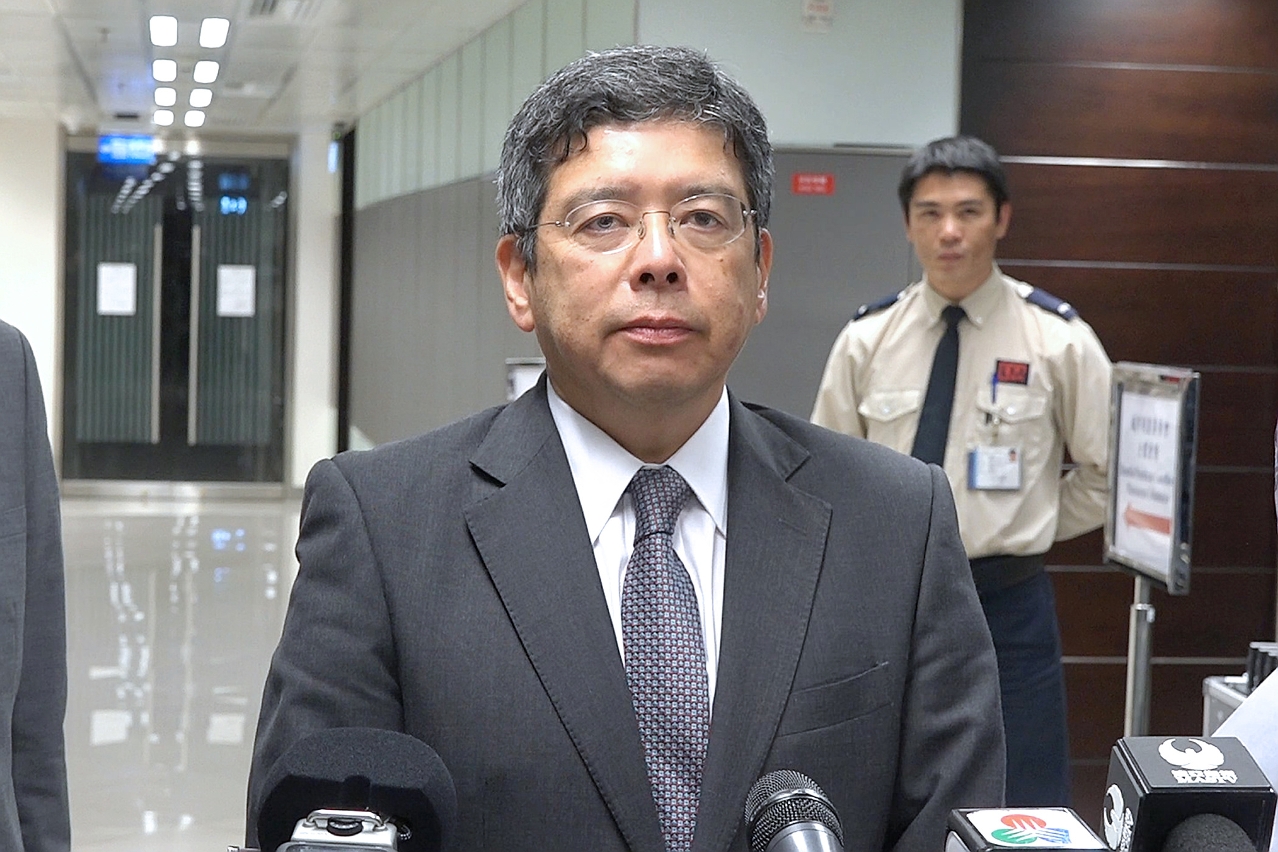 Secretary for Transport and Public Works, Mr Raimundo do Rosário, speaks to reporters.
