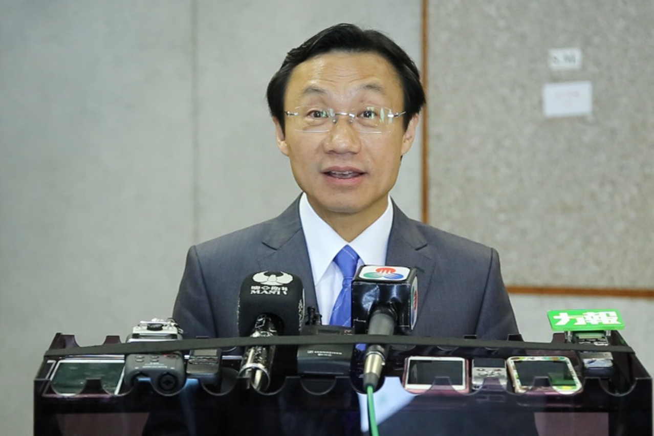 Secretary for Social Affairs and Culture, Mr Tam Chon Weng, speaks to reporters.