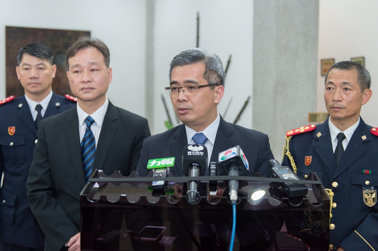 Secretary for Security, Mr Wong Sio Chak, speaks to reporters.