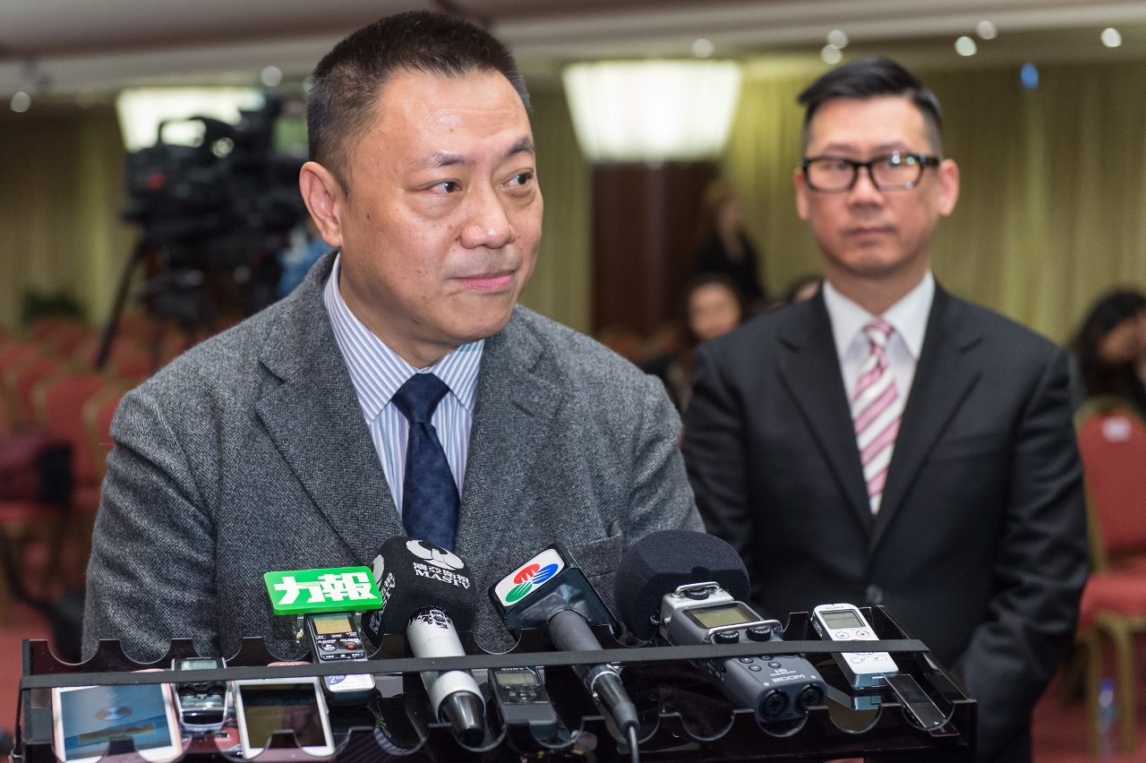 Secretary for Economy and Finance, Mr Leong Vai Tac, speaks to reporters.