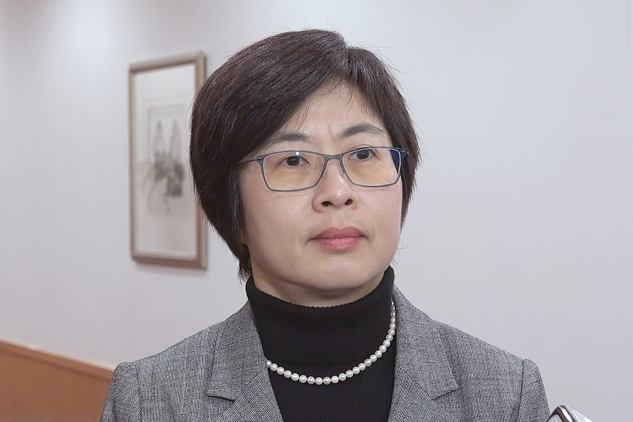 Secretary for Administration and Justice, Ms Chan Hoi Fan, speaks to reporters.