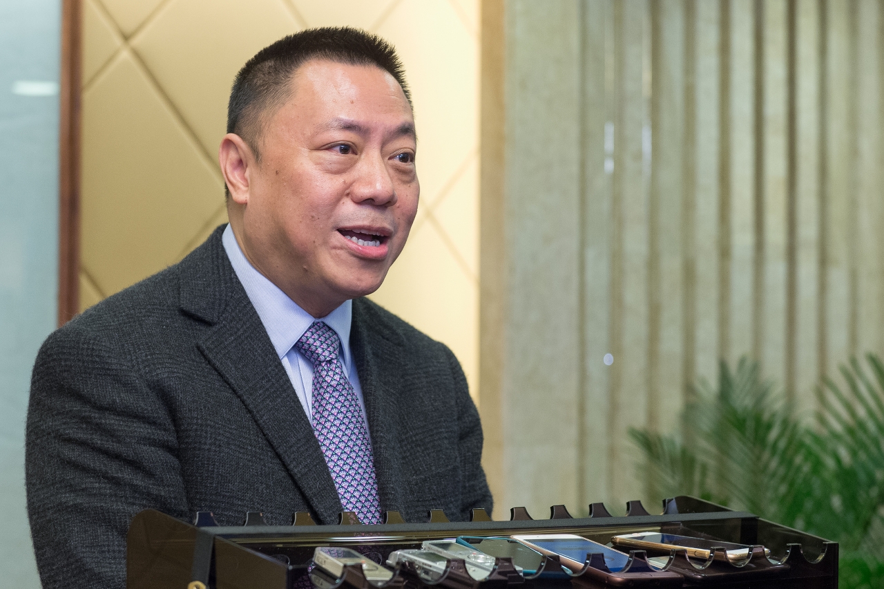Secretary for Economy and Finance, Mr Leong Vai Tac, speaks to reporters.