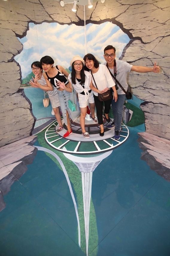 Visitors take photos at “Macau 3D Art Wall”