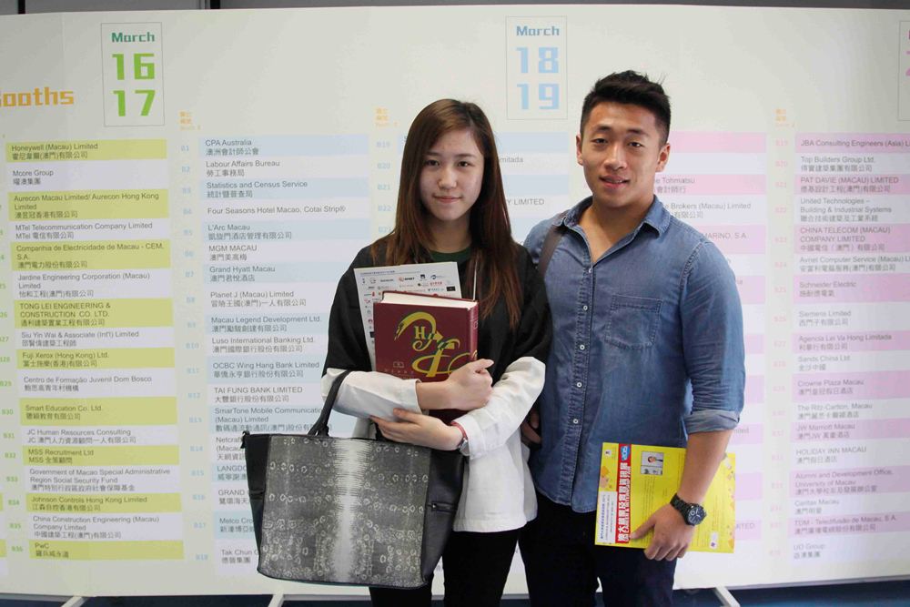 Students Lucia Luo and David Choi learn more about the job market at the fair