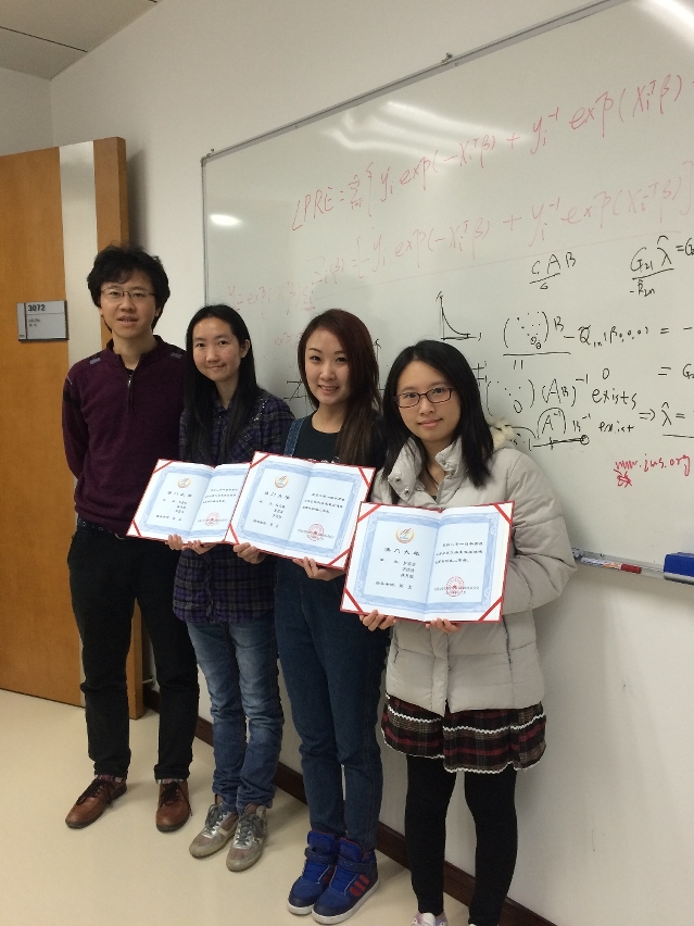 Three winning students with their professor