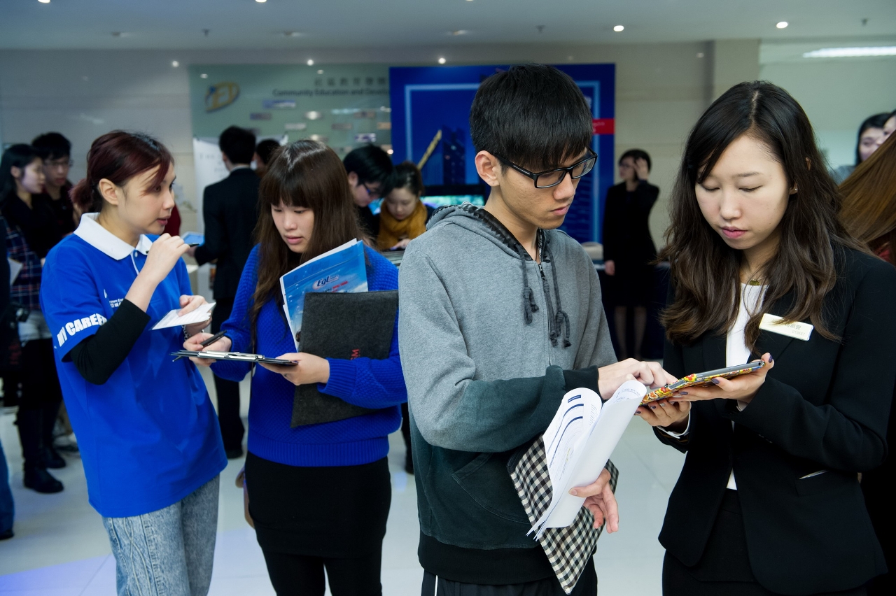 Students enquiring career opportunities from companies.