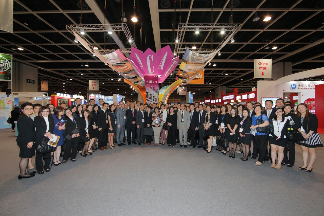 Betty Fok and trade delegates at booth