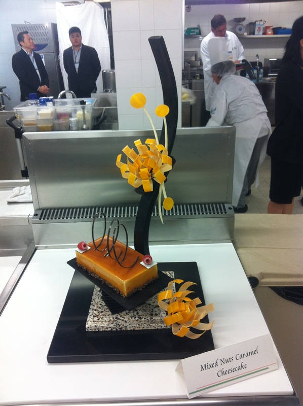 Jeffrey Lao (right)  and his team member Gordon Hoi’s (left)  awarded piece “Mixed Nuts Caramel Cheesecake”.