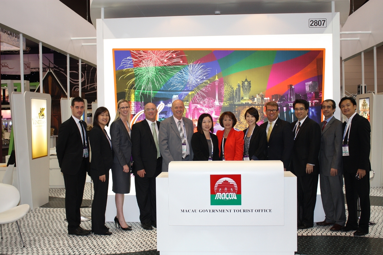 Group photos of MGTO and Macau trade representatives in front of Macau promotional booth at AIME
