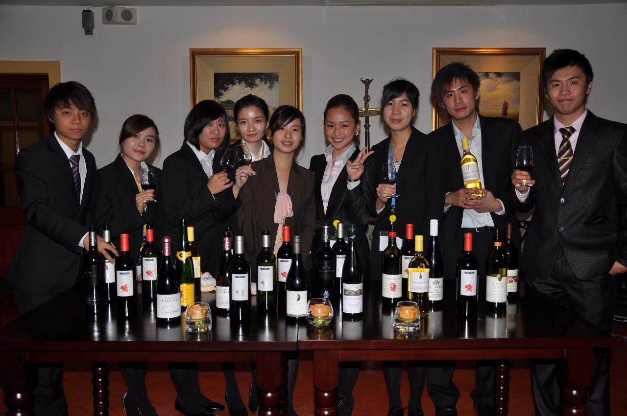 Students hosting the “CHEERS! Wine Charity Event”