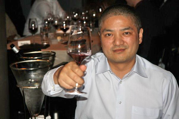 Mr. David Wong is doing wine tasting