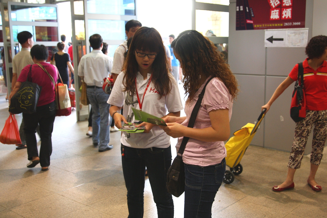 Staff explain to travelers