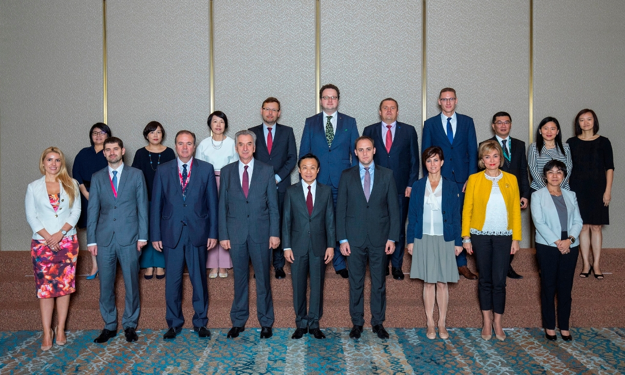 Group photo of Secretary Tam and delegates of the 16 CEECs at breakfast meeting