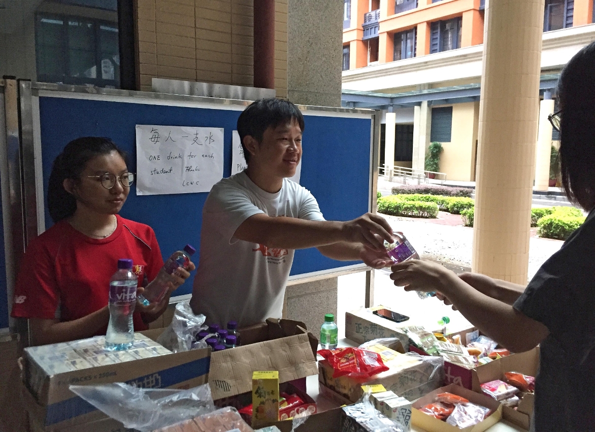 UM members support each other in the aftermath of the typhoon