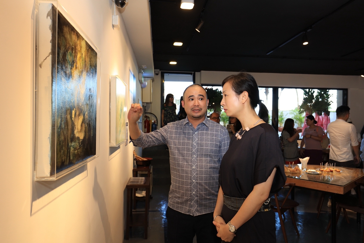 Guests appreciating the artwork of the exhibition