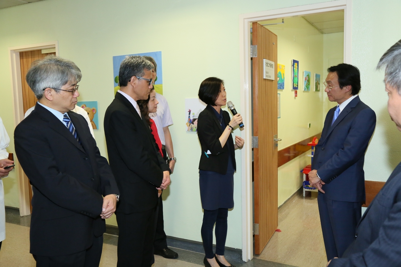 Mr Tam Chon Weng is briefed on the facilities at the new integrated centre for child assessment