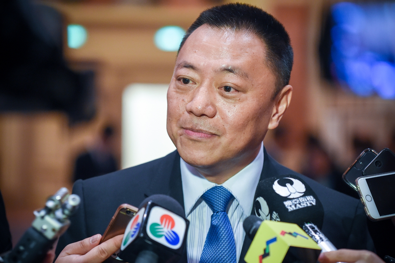 Secretary for Economy and Finance, Mr Leong Vai Tac, speaks to reporters.