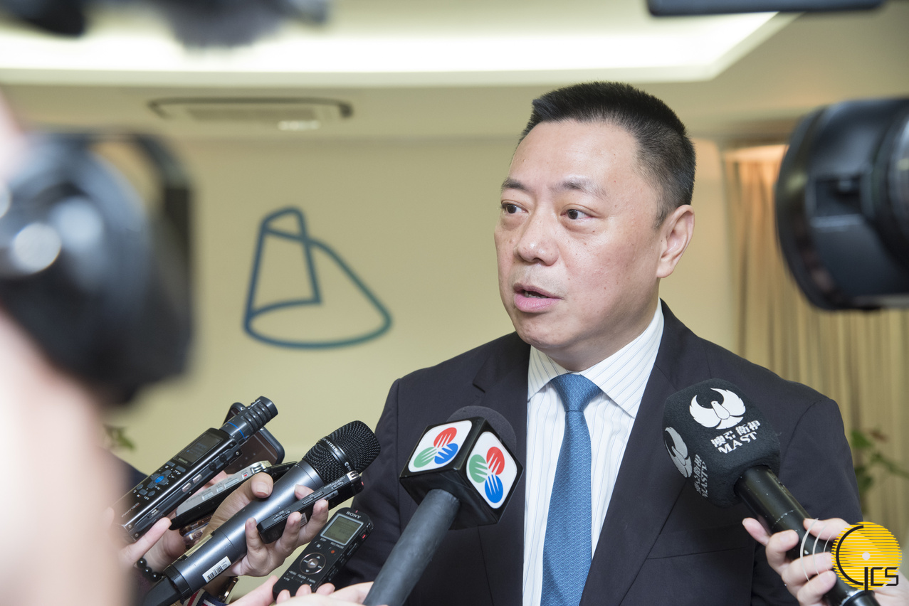 Secretary for Economy and Finance, Mr Leong Vai Tac, speaks to reporters.