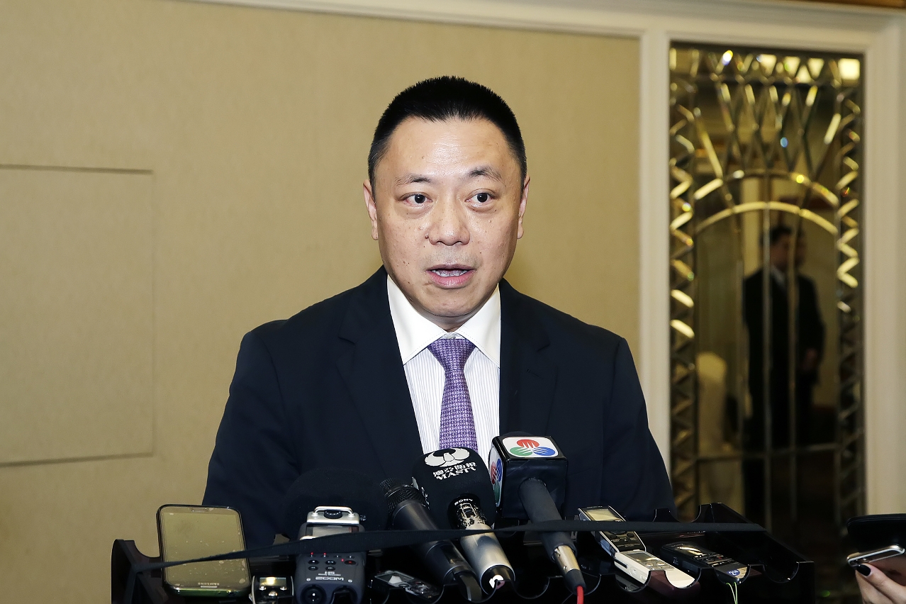 Secretary for Economy and Finance, Mr Leong Vai Tac, speaks to reporters.