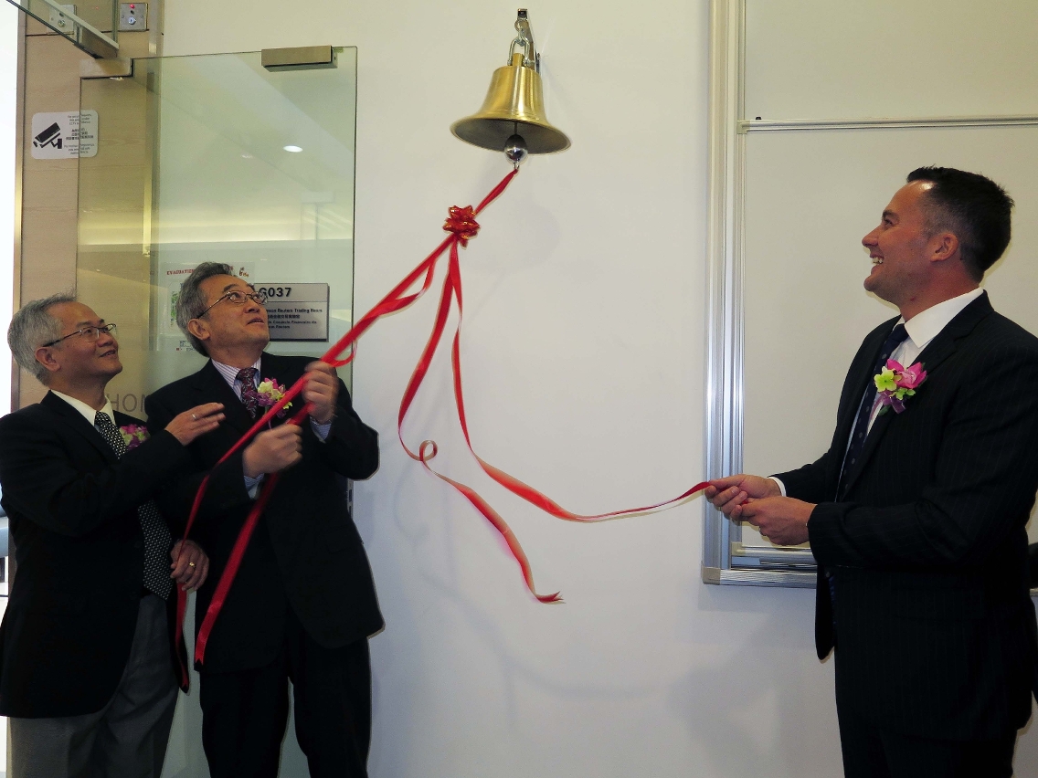Officiating guests ring the opening bell in the trading room