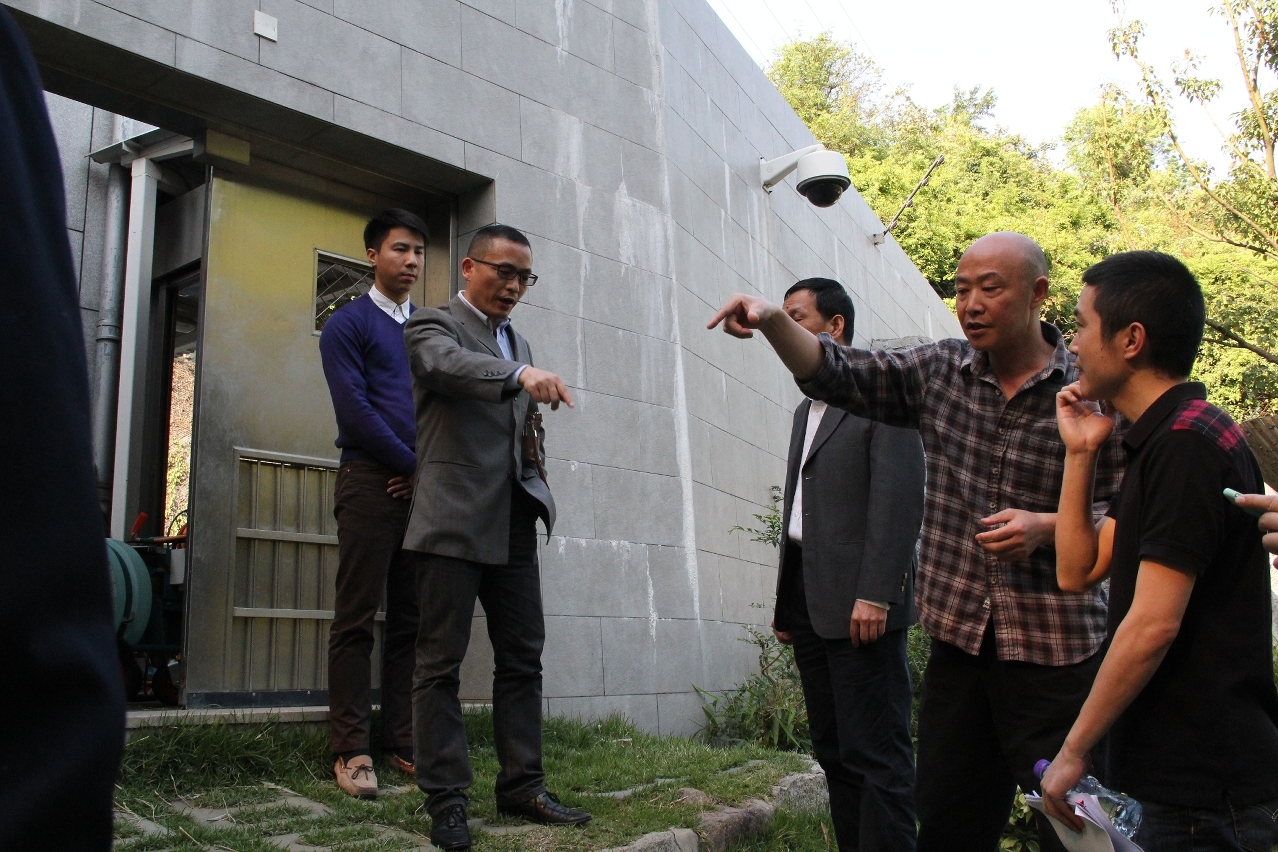 Members of the expert team inspect outdoor facilities of the Macao Giant Panda Pavilion.