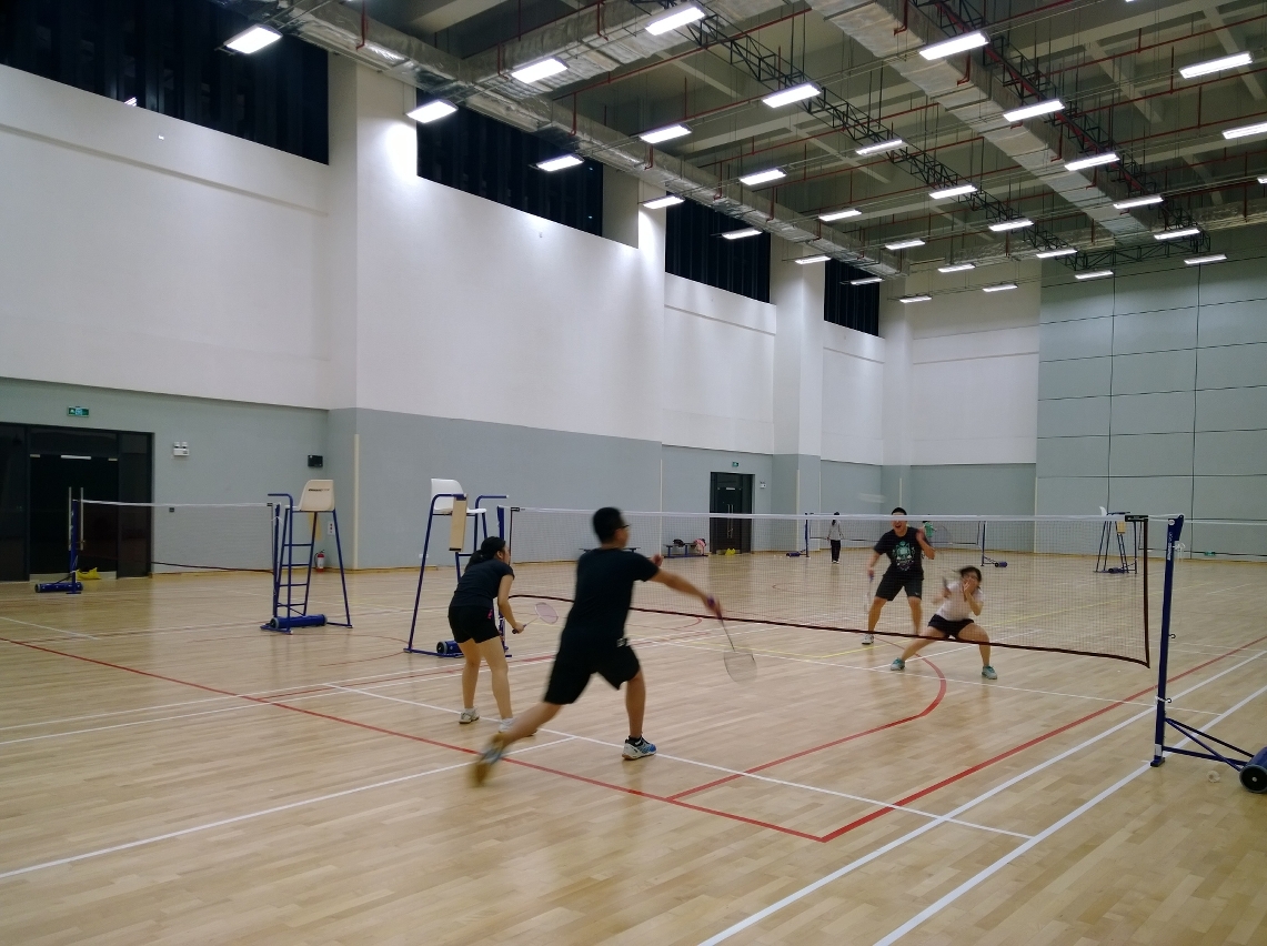 UM members play badminton in the UM Sports Complex