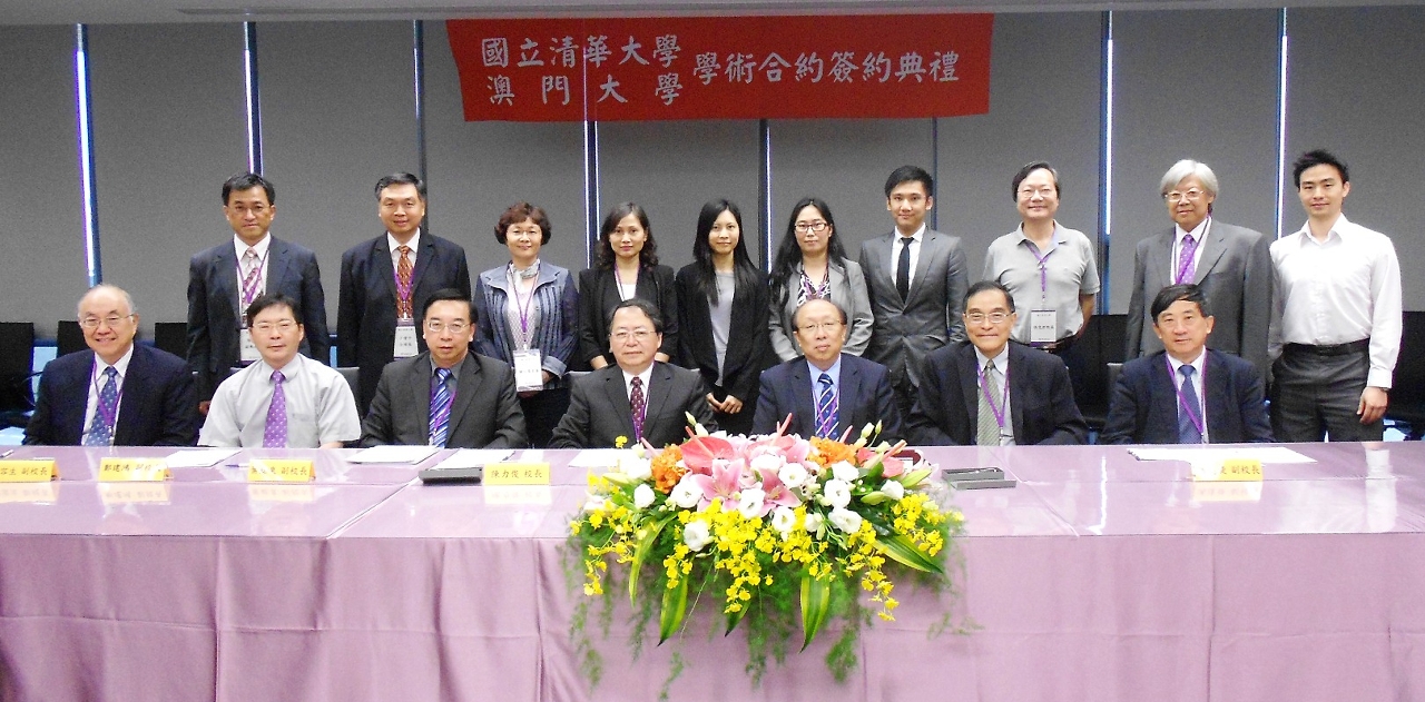 .Group photo of representatives from the two universities