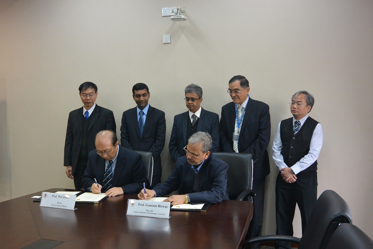 UM Rector Wei Zhao and IITG Rector Gautam Biswas sign the MOU