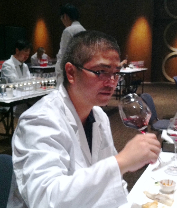 Mr. David Wong doing wine tasting