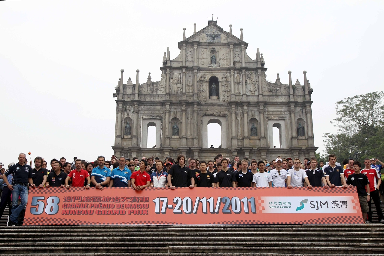 Competitors of the three headline races pose in front of the Ruins of St. Paul's