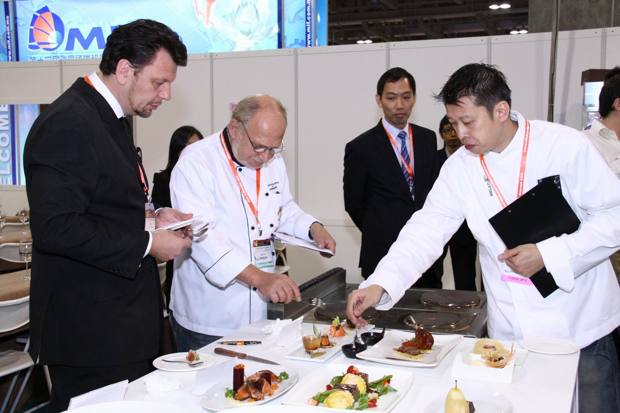 Judges are assessing the presentation of the dishes.